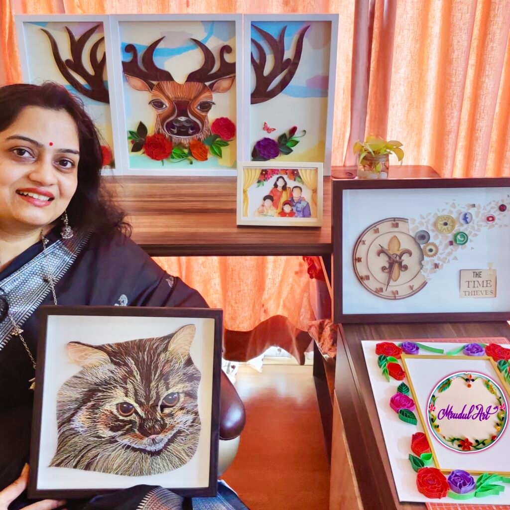Mrudula Tandel with a collection of her handmade paper artworks